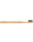 Afbeelding van een bamboe tandenborstel met Charcoco liggend